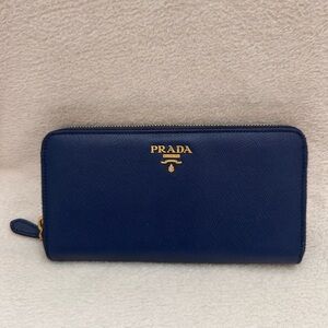 Prada navy blue Saffiano Lux leather zip-around wallet with Gold Logo